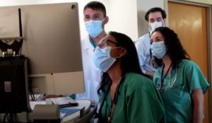 medical residents looking at a monitor